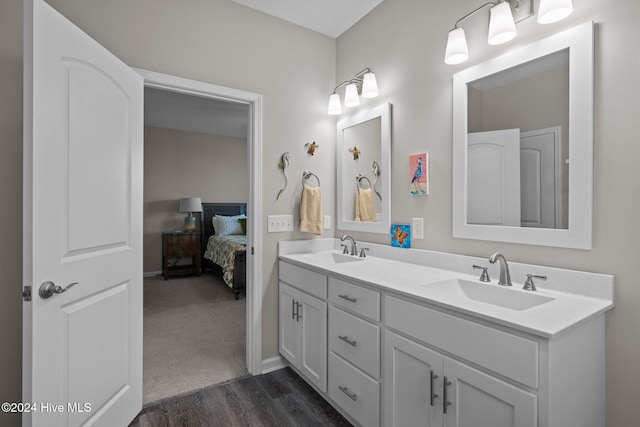 bathroom featuring vanity and hardwood / wood-style flooring