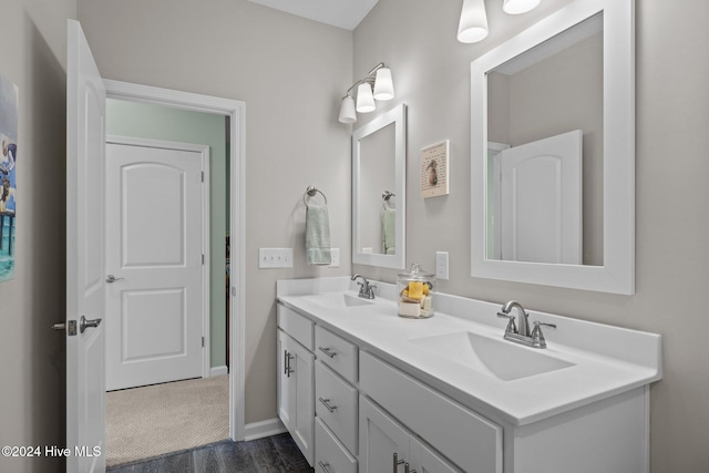 bathroom with vanity and hardwood / wood-style flooring