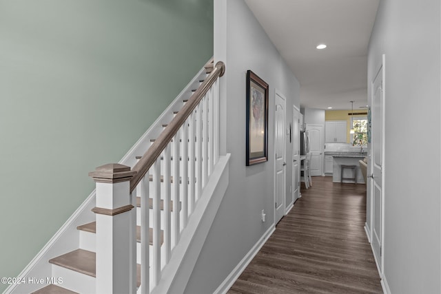 corridor featuring dark hardwood / wood-style floors