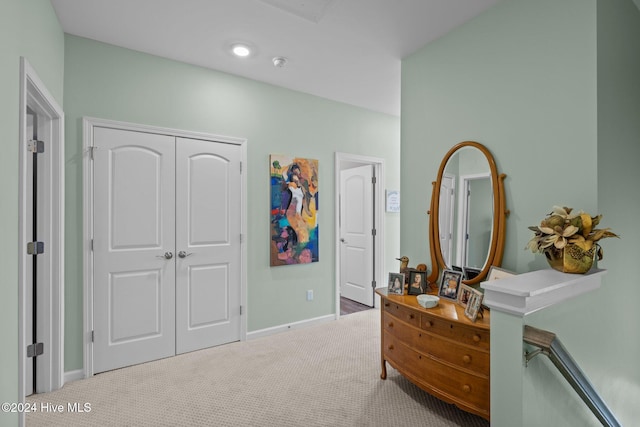 carpeted bedroom featuring a closet