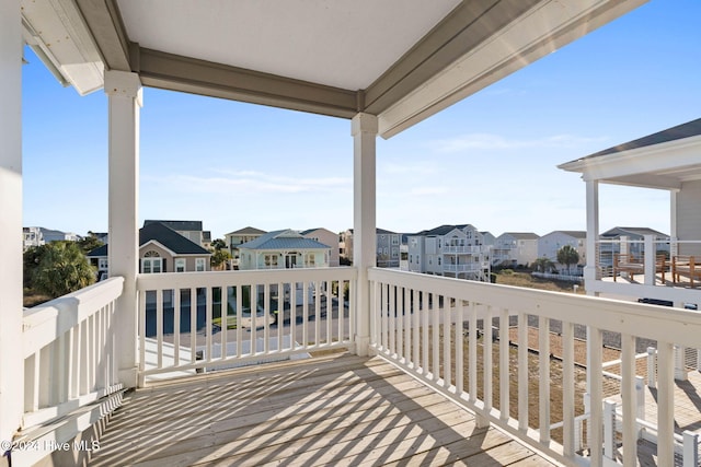 wooden terrace featuring a residential view