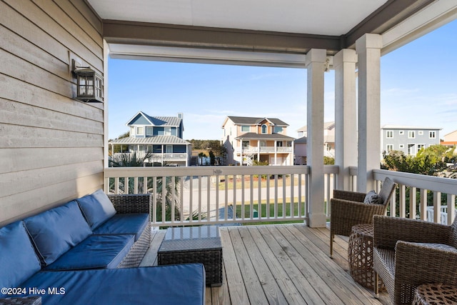 balcony with a residential view and an outdoor hangout area