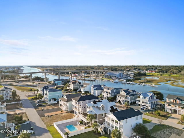 drone / aerial view with a water view and a residential view