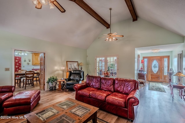 living room with ceiling fan, beam ceiling, high vaulted ceiling, and light hardwood / wood-style flooring