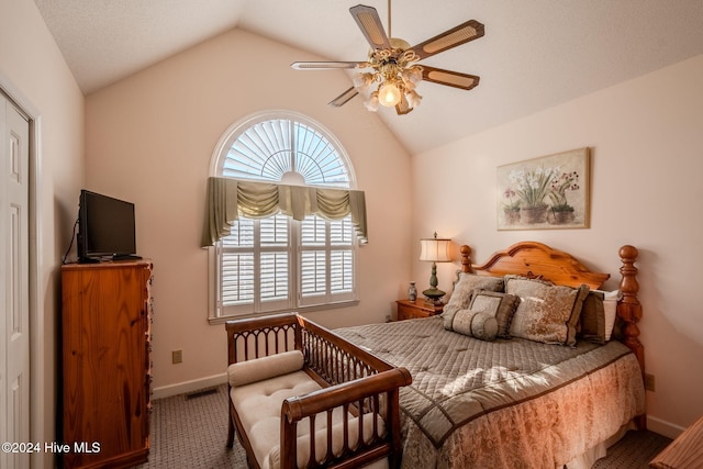 bedroom featuring carpet floors, ceiling fan, and lofted ceiling