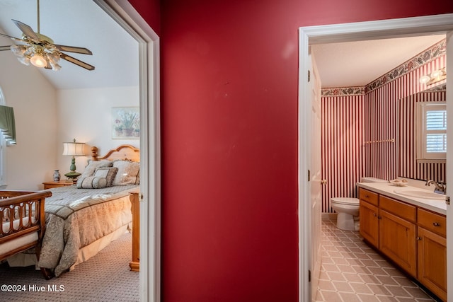 interior space featuring ceiling fan and sink