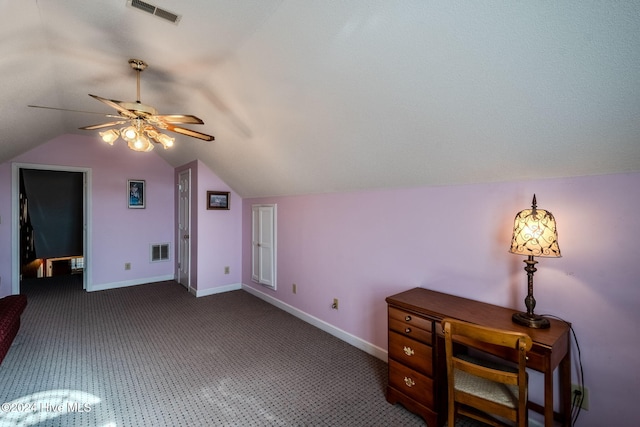 additional living space with ceiling fan, lofted ceiling, and dark colored carpet