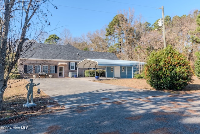 ranch-style home with a carport