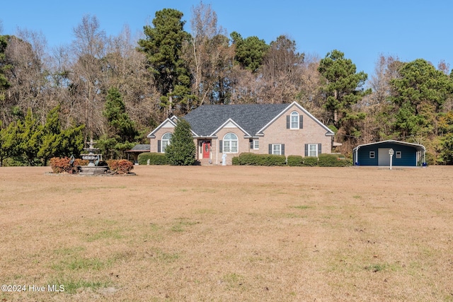 front facade featuring a front yard and a carport