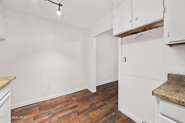 interior space featuring white cabinetry and dark hardwood / wood-style flooring