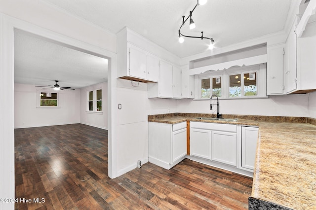 kitchen with a textured ceiling, ceiling fan, sink, dark hardwood / wood-style floors, and white cabinetry