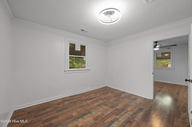 spare room featuring a textured ceiling, ceiling fan, dark hardwood / wood-style floors, and ornamental molding