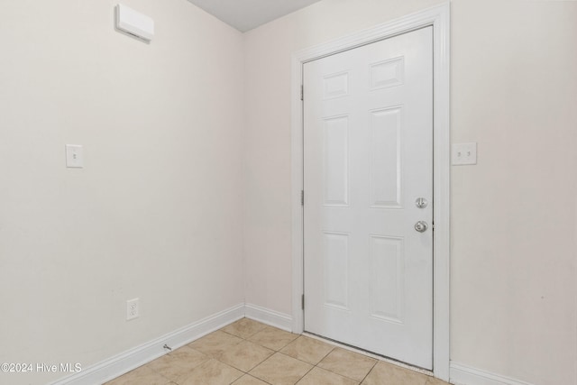 entryway featuring light tile patterned floors