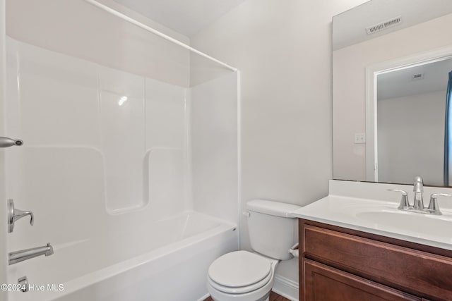 full bathroom featuring vanity, toilet, and washtub / shower combination