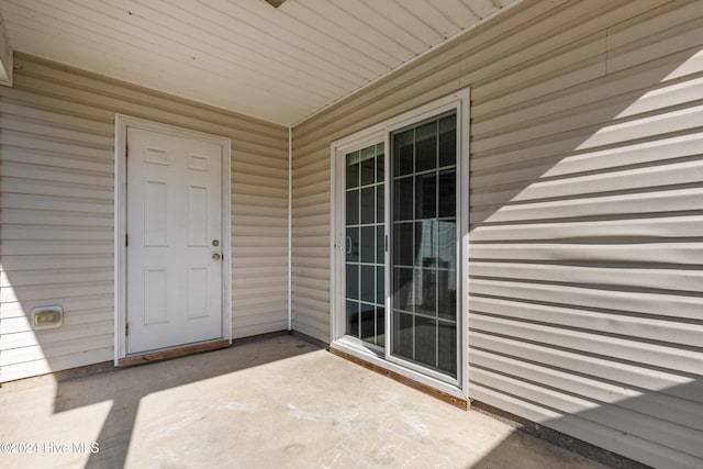 doorway to property featuring a patio area