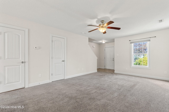 unfurnished room featuring carpet flooring and ceiling fan