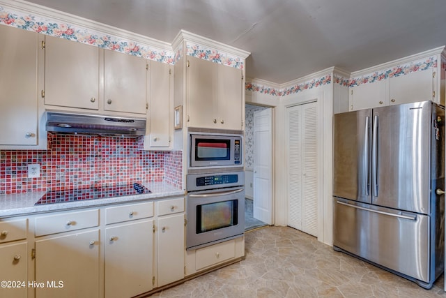 kitchen featuring appliances with stainless steel finishes, tasteful backsplash, and ornamental molding