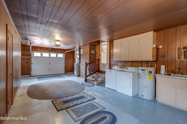 garage featuring sink, electric water heater, wood walls, and wood ceiling