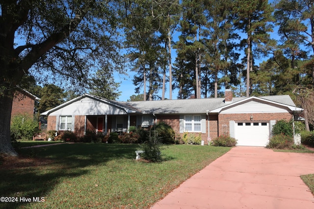 ranch-style home with a front lawn and a garage