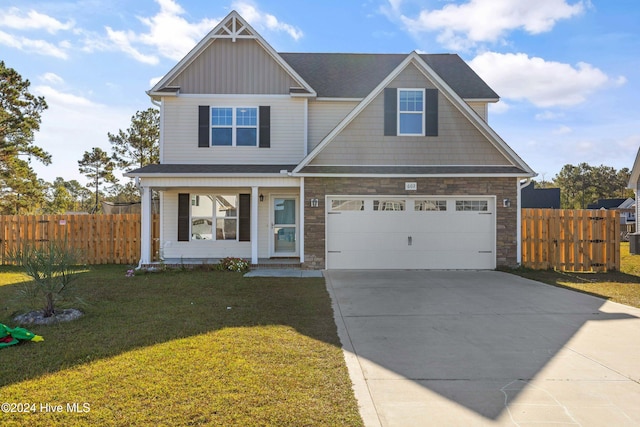 view of front facade with a front yard and a garage