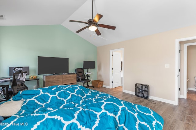 bedroom featuring hardwood / wood-style floors, ceiling fan, and vaulted ceiling