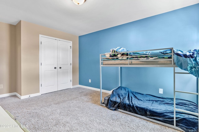 carpeted bedroom with a closet