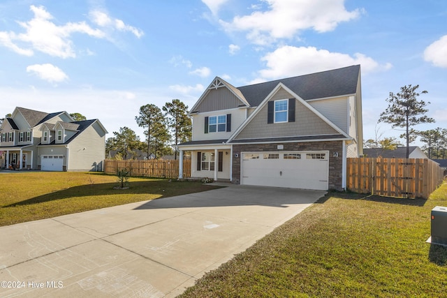 craftsman-style home with a garage and a front lawn