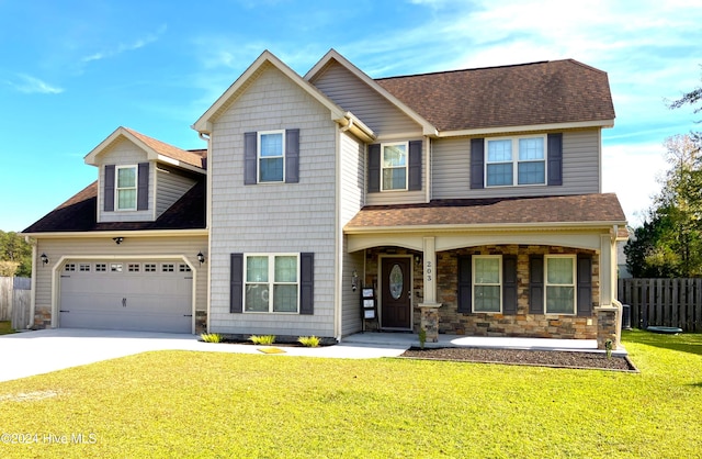 view of front facade featuring a garage and a front lawn