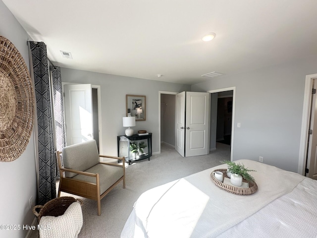 bedroom featuring light carpet and visible vents