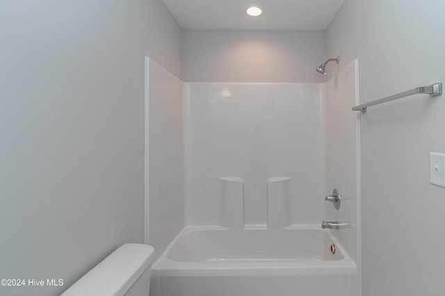 bathroom featuring  shower combination and toilet