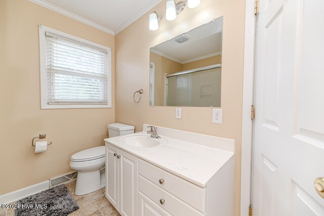 bathroom featuring vanity, a shower with door, tile patterned floors, toilet, and ornamental molding