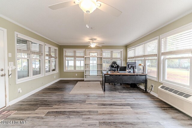 office space featuring radiator heating unit, hardwood / wood-style flooring, ceiling fan, and crown molding