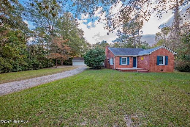 view of front facade featuring a garage, a front lawn, an outdoor structure, and a wooden deck