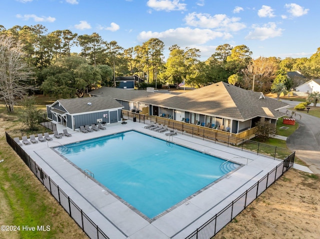 view of swimming pool with a patio area