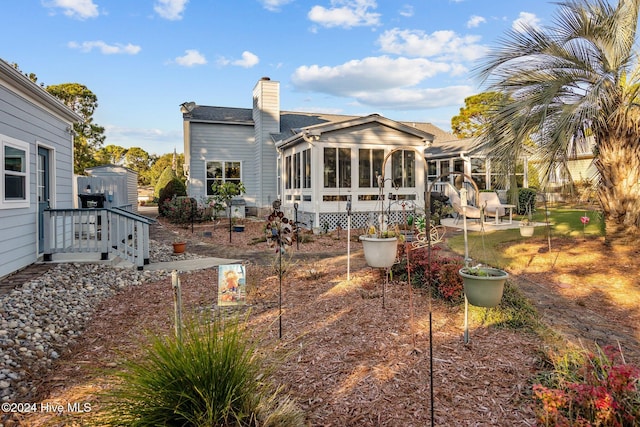 back of house with a sunroom