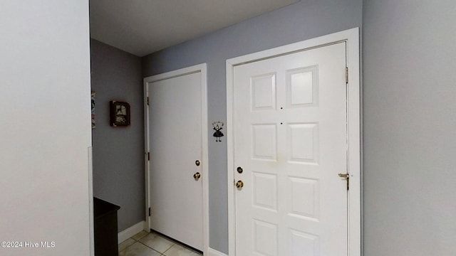 entryway with light tile patterned floors