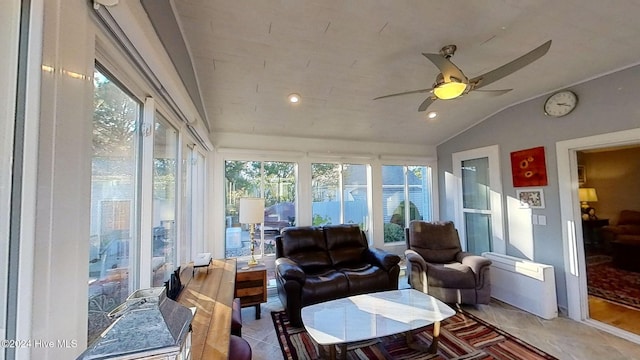 sunroom with ceiling fan and lofted ceiling