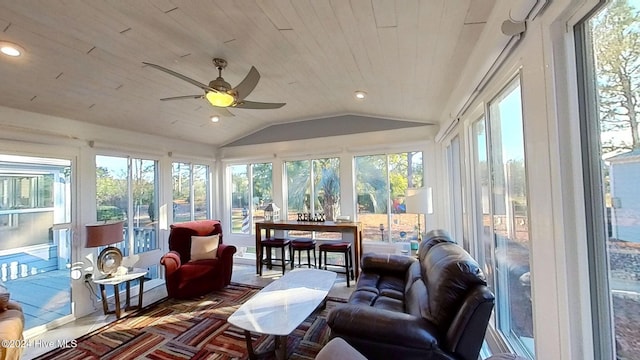 sunroom with wood ceiling, ceiling fan, lofted ceiling, and plenty of natural light