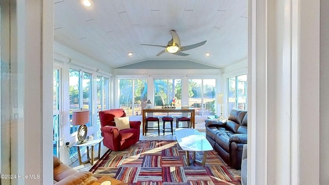 sunroom / solarium featuring vaulted ceiling and ceiling fan