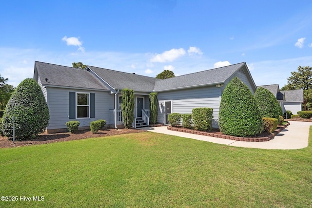 single story home featuring a front yard and roof with shingles