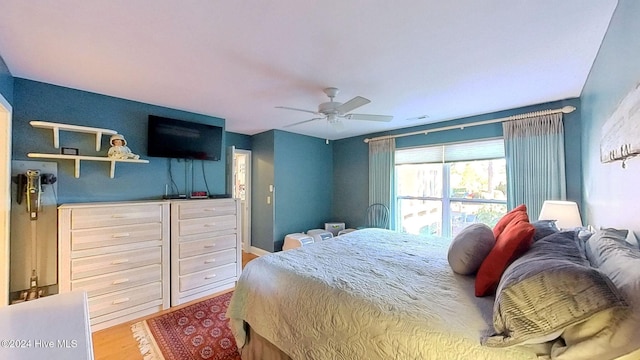 bedroom featuring hardwood / wood-style floors and ceiling fan