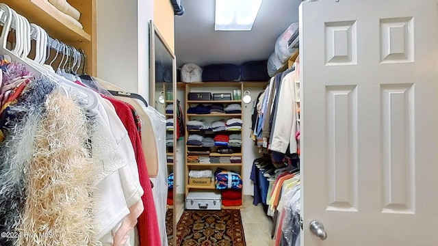 spacious closet featuring tile patterned flooring