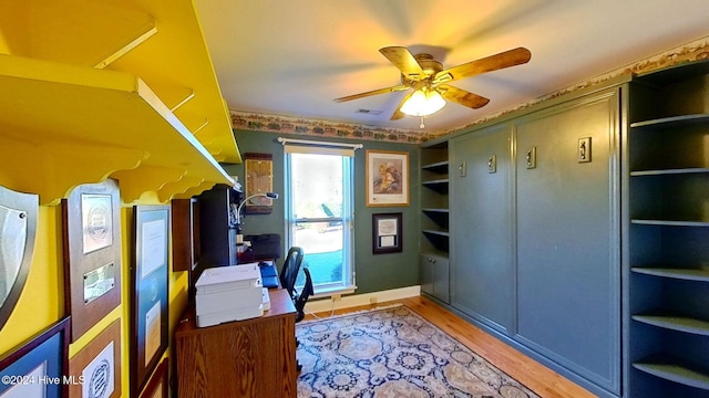 office space with ceiling fan and light wood-type flooring