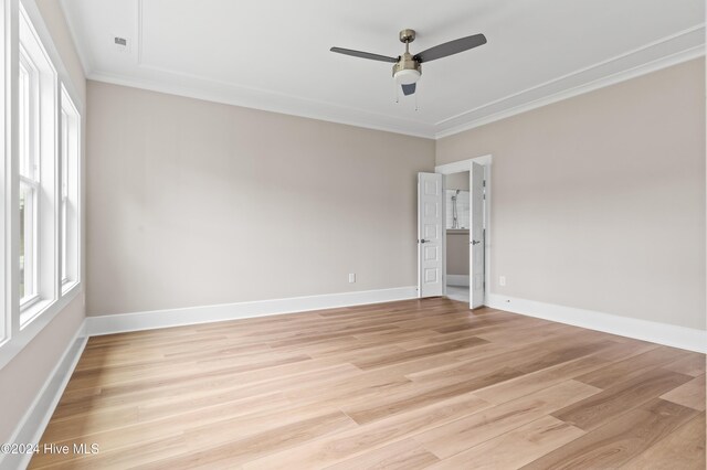 unfurnished room featuring ceiling fan, ornamental molding, and light hardwood / wood-style flooring