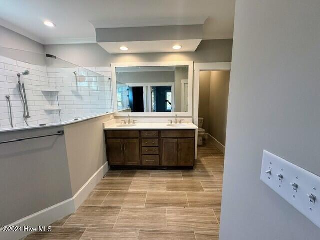 bathroom featuring vanity and an enclosed shower