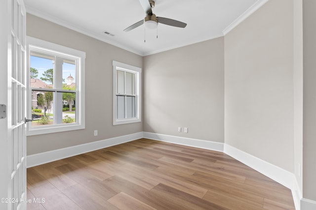 spare room with ceiling fan, light hardwood / wood-style floors, and ornamental molding