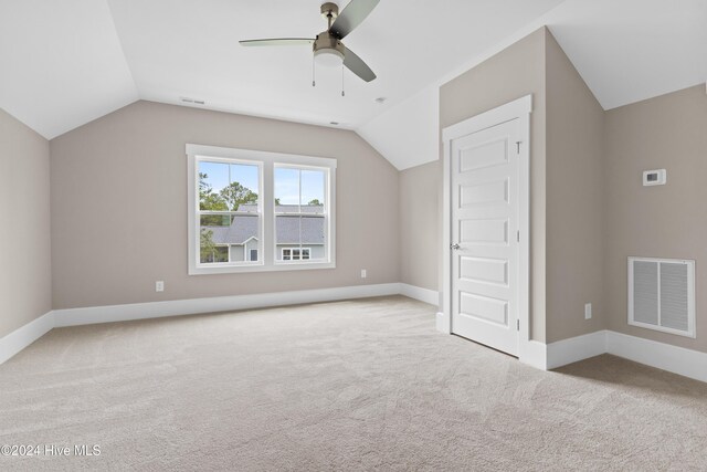 bonus room featuring ceiling fan, light colored carpet, and vaulted ceiling