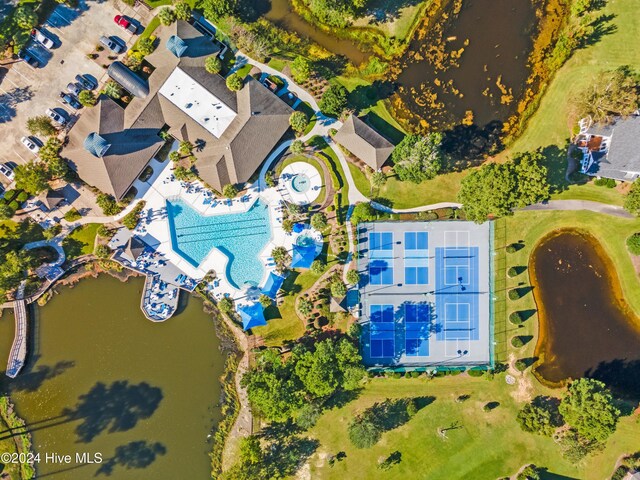 birds eye view of property with a water view