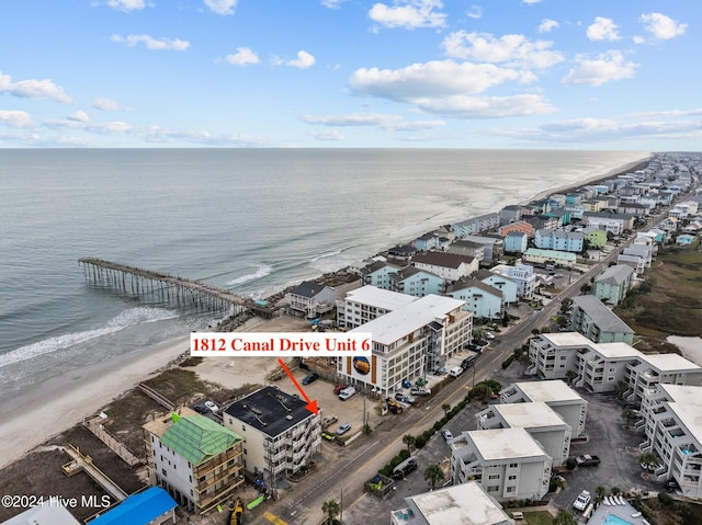 drone / aerial view with a view of the beach and a water view