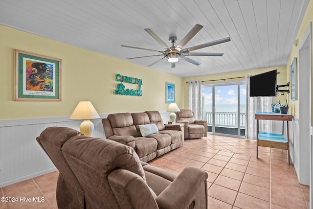 tiled living room featuring ceiling fan